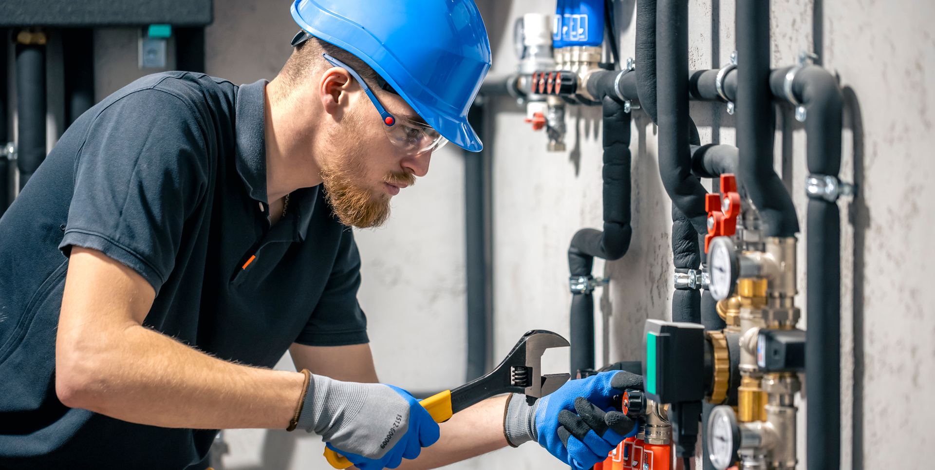 Plumber installing a hot water system